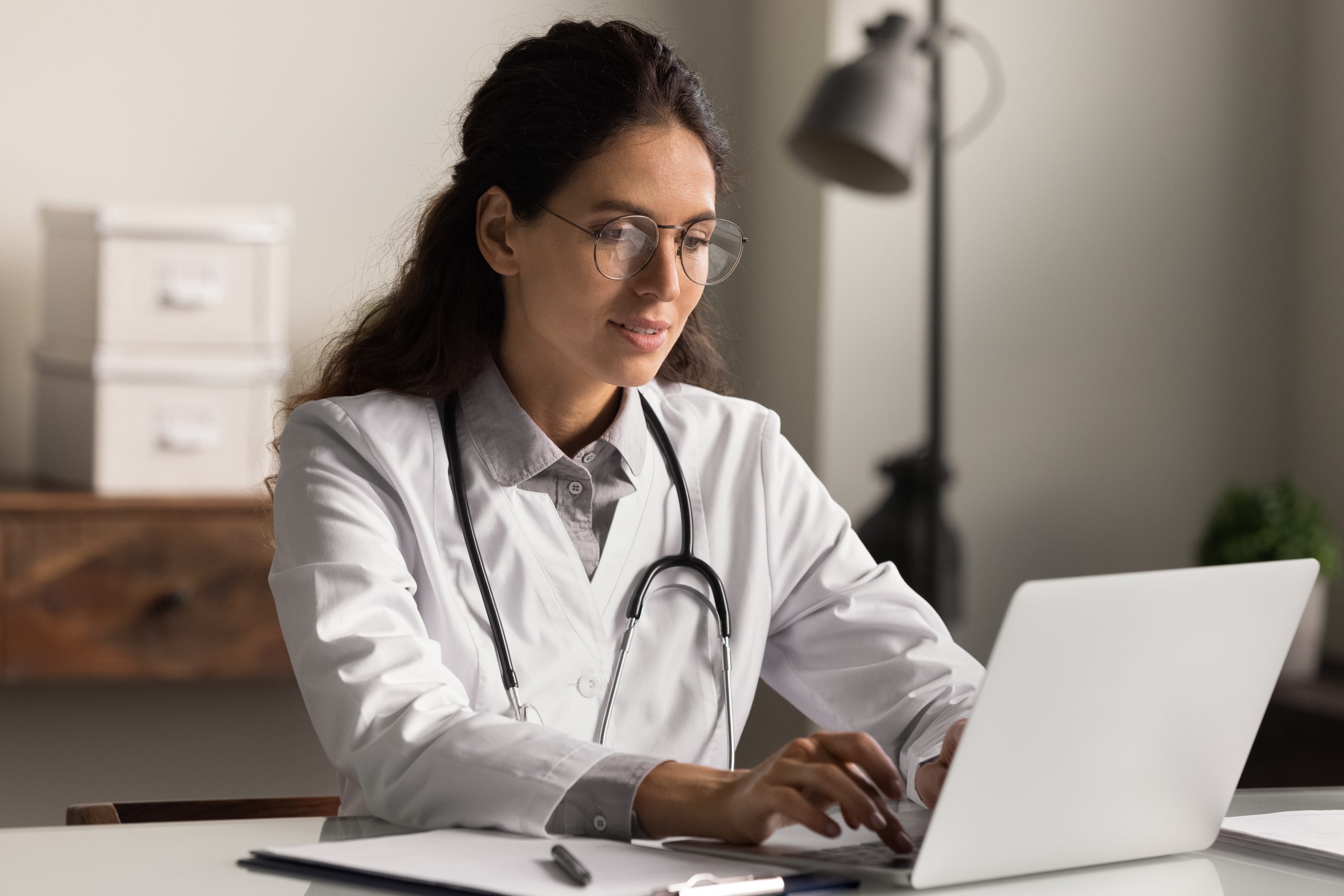Focused,Female,Gp,Or,Nurse,In,White,Medical,Uniform,Look